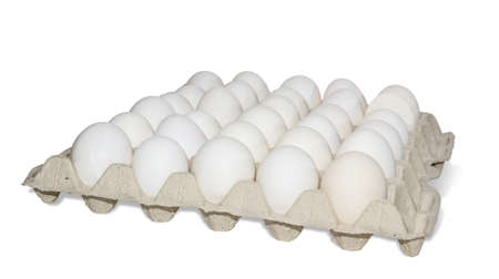 Tray with white chicken eggs on a light background. Isolation.の写真素材