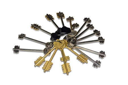 Great bunch of different keys to door locks, located as a fan on a light background. Isolation.の写真素材
