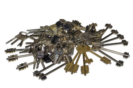 Many bunch of different keys to door locks on a light background. Isolation.の写真素材