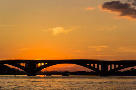 Sunset on the Dnieper. View of the bridges and right bank of Dnieper. Kyiv, Ukraine.の写真素材