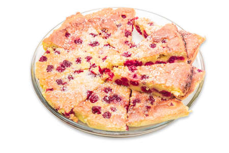 Clafoutis - a tart made of cherries, baked in a sweet batter, on a big transparent glass plate. French national dish. Isolationの写真素材