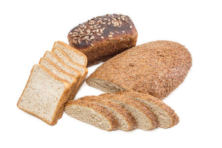 Bread with bran partly sliced, sliced bread for toasting and brown bread with whole grain cereals on a light background. Isolationの写真素材