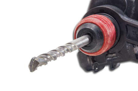 Masonry drill bit in a chuck of a hammer drill closeup. Isolation.の写真素材