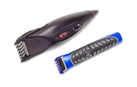 Electric hair clipper and mini hair trimmer for hair care beard and mustache on a light background....