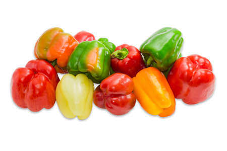 Pile of a fresh bell peppers various shapes and colors on a light background. Isolation.の写真素材