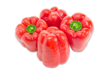Several fresh red bell peppers on a light background. Isolation.の写真素材