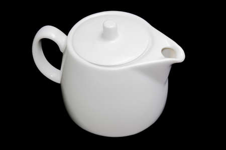 White porcellaneous teapot on a black background. Isolation.の写真素材