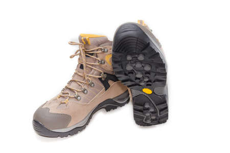 Men's light brown leather trekking boots on a light background. Isolation.の写真素材