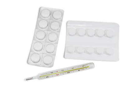 Classic mercury medical thermometer and two packaging of medications - round white tablets in...