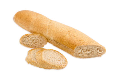 Long thin loaf of wheat bread with bran, partially sliced closeup on a light background. Isolationの写真素材