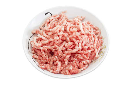 Ground meat, made from a pork in bowl on a light background. Isolation.の写真素材