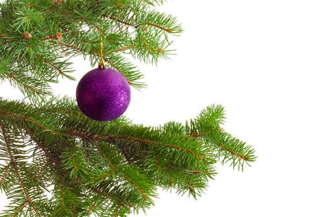 Fragment of a decorated Christmas trees with Christmas Christmas ornaments on a light backgroundの写真素材