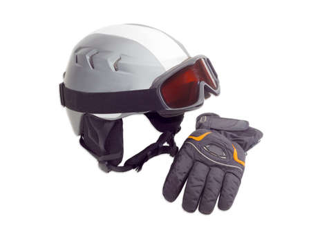 Gray protective ski helmet, ski goggles and black ski glove on a light backgroundの写真素材