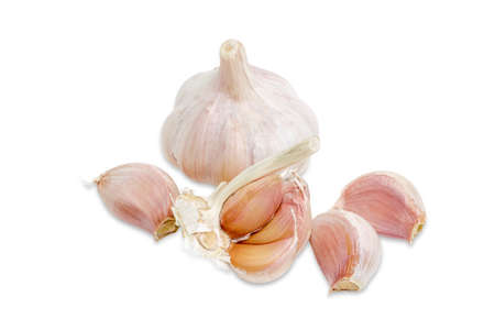 Garlic bulb and a few garlic cloves on a light background closeupの写真素材