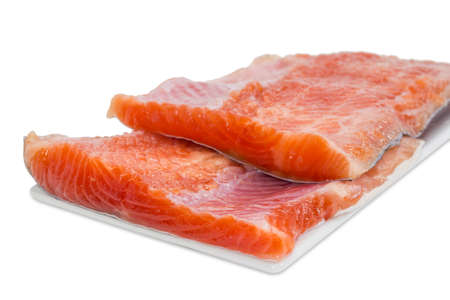 Two pieces fillet of rainbow trout on a light background closeupの写真素材