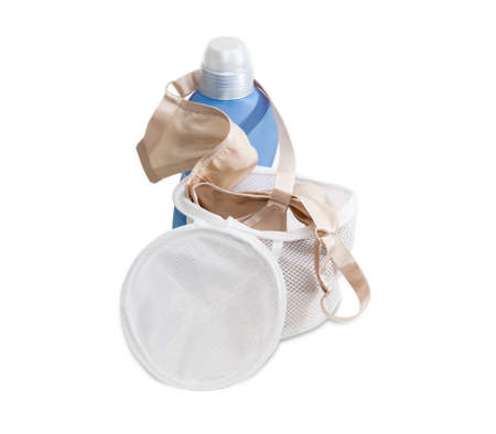 Special laundry bag for washing bras in washing machine against the background blue plastic bottle of a detergent on a light backgroundの写真素材