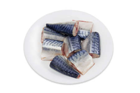 Sliced pickled atlantic mackerel on a white dish on a light backgroundの写真素材