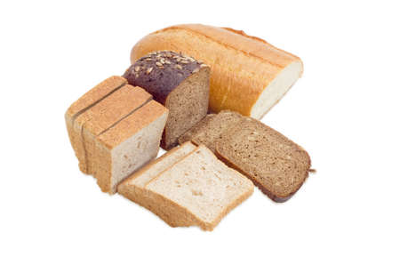 Wheat bread, sliced bread for toasting, partly sliced bread with whole grain of a sunflowers on a light backgroundの写真素材