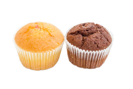 One sweet muffin with jam and one chocolate muffin in a paper cups on a light backgroundの写真素材