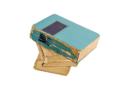 Stack of three old shabby books on a light backgroundの写真素材