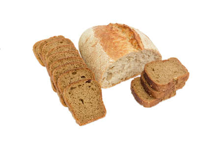 Half loaf of wheat unleavened bread with bran and sliced brown bread with whole grain on a light...
