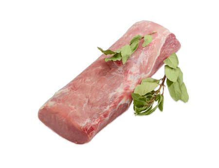 Piece of a fresh uncooked pork tenderloin and two branches of dried bay leaves on a light backgroundの写真素材