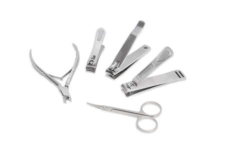 One nail clipper in the pliers style, three nail clippers different sizes and nail scissors made of stainless steelの写真素材