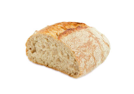 Half loaf of unleavened bread made from wheat and rye meal with bran on a light backgroundの写真素材