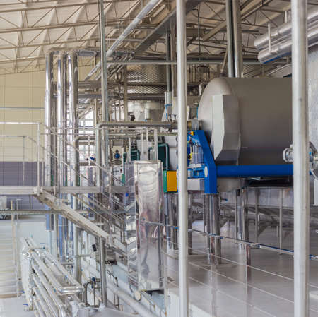 Stainless steel vessels and pipework, other equipment in workshop of primary grapes processing and...