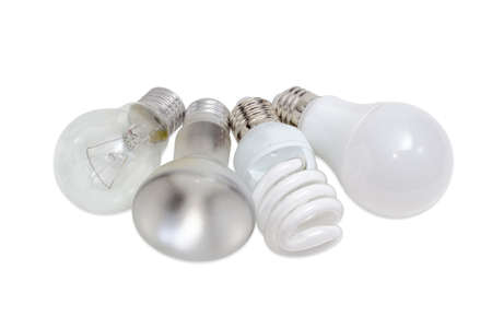 Electric lamps of different types of electric lighting - incandescent lamp ordinary and lamp with specular coated of bulb, compact fluorescent lamp and light-emitting diode lamp on a light backgroundの写真素材