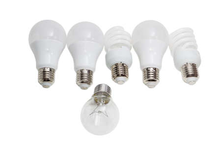 Incandescent lamp against several modern energy saving electric lamps - compact fluorescent lamps and light emitting diode lamps on a light backgroundの写真素材