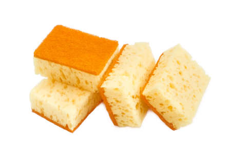 Several yellow synthetic cleaning sponges with layer for more intense scrubbing on a light backgroundの写真素材