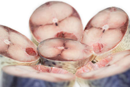 Several pieces of chopped uncooked atlantic mackerel closeupの写真素材