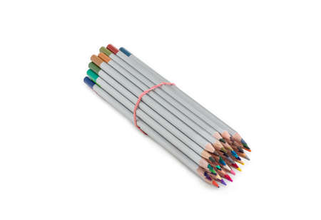 Bunch of colored pencils in gray wooden case, tied with a rubber band on a light backgroundの写真素材