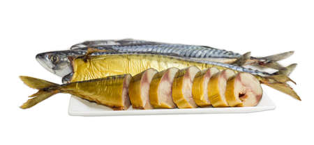 Sliced and whole cold-smoked Atlantic mackerel on a white dish against the backdrop of uncooked fish on a light background
の写真素材