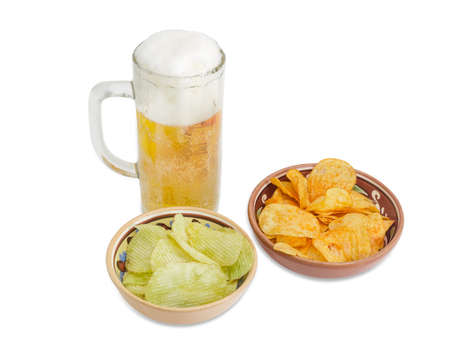 Beer glassware with lager beer, potato chip flavored paprika and wasabi in two different ceramic bowls on a light background
の写真素材