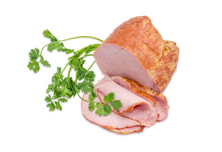 Partly sliced smoked cooked ham with pork loin and a twig of the cilantro on a light backgroundの写真素材