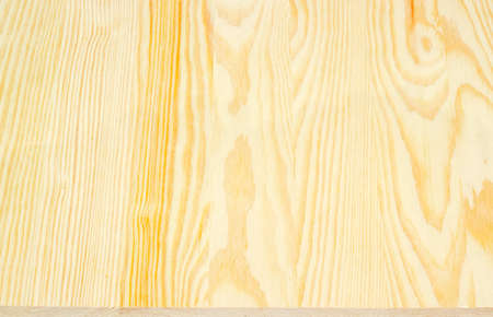 Background of a wooden surface made of the light-colored pine planksの写真素材