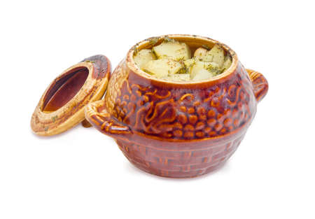 Dish Chanakhi - potatoes with meat, mushrooms and haricot beans roasted in a clay pot with cover on a white backgroundの写真素材