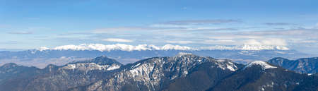 Panorama of the mountain range Tatra Mountains from slopes of Low Tatras and valley between them...