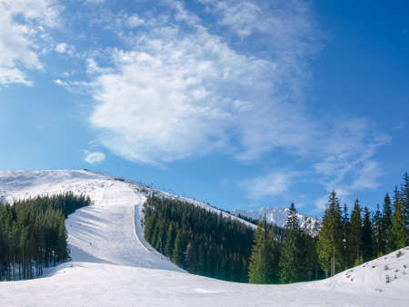 Ski piste on north slope of the mountain Chopok on background of a sky on ski resort Jasna in Low Tatras mountains, Slovakia
の写真素材