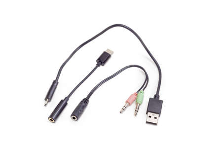 Several different audio and USB cables for connection various gadgets on a white background