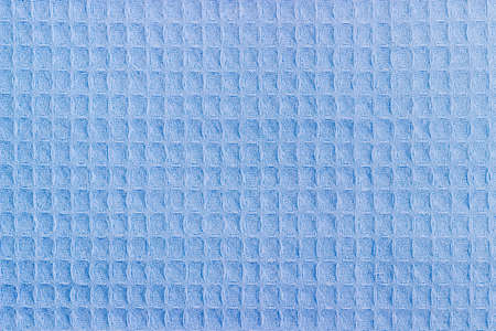 Background of the blue waffle towel with horizontal layout of pattern closeupの写真素材
