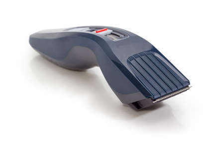 Electric hair clipper with hair cutting height adjustment at selective focus on a white background
