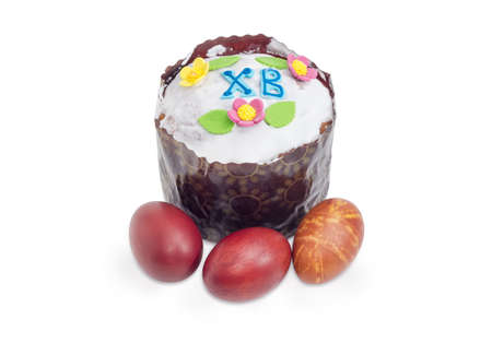 Easter cake decorated with white icing and colorful sugar decors, wrapped in special parchment...