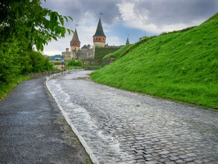 Road covered with cobbles to the medieval Kamianets-Podilskyi fortress, built in the 15th century,...
