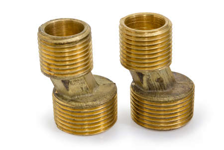 Two brass eccentric connectors for the wall water mixer tap installation closeup on a white...