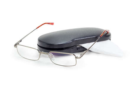 Modern pair of the classic men's eyeglasses in metal frame and black hard plastic spectacle-case...