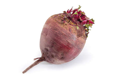 Whole uncooked red beetroot on a white background