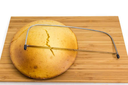 Cake leveler cutter slicer with serrated knife and adjusting to layer height for cutting cake layers...